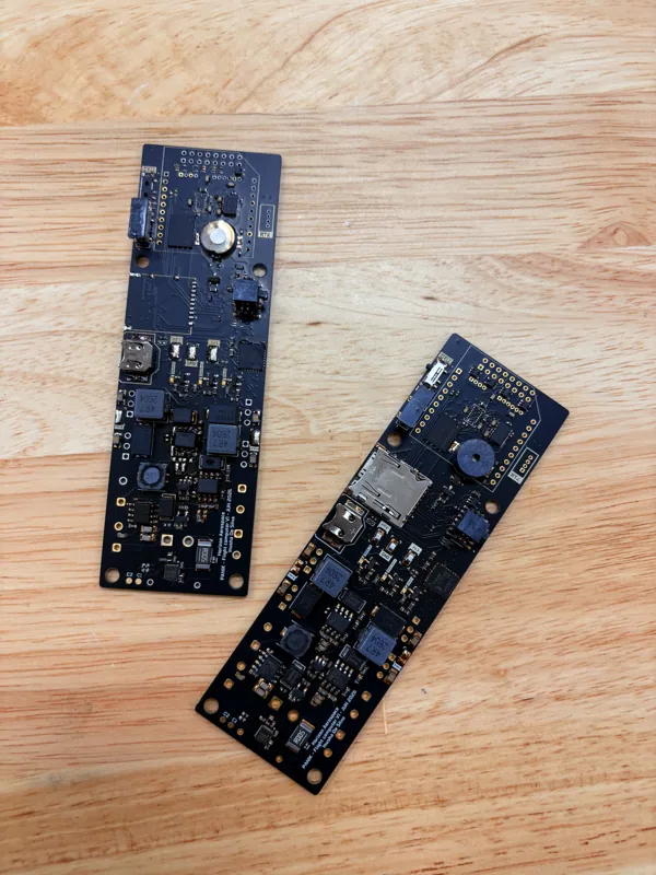 Two circuit boards arranged on the electronics workbench