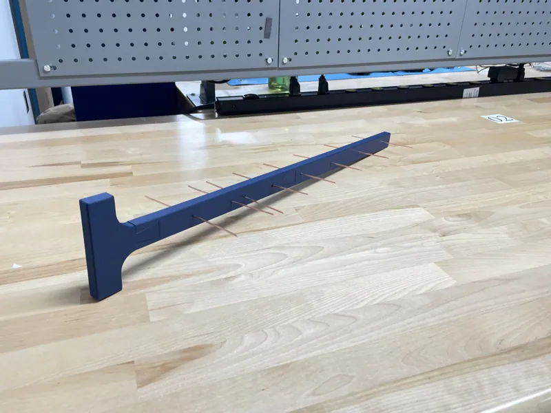 Assembled Yagi antenna on a workshop bench